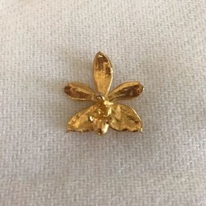Miniature Orchid dipped in Gold. Can be worn as a broach or necklace.